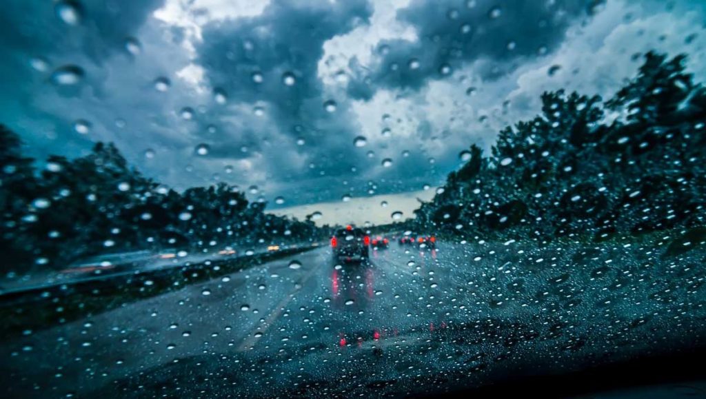 Driving in rain - rainy streets photo through windshield