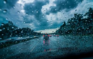 Driving in rain - rainy streets photo through windshield
