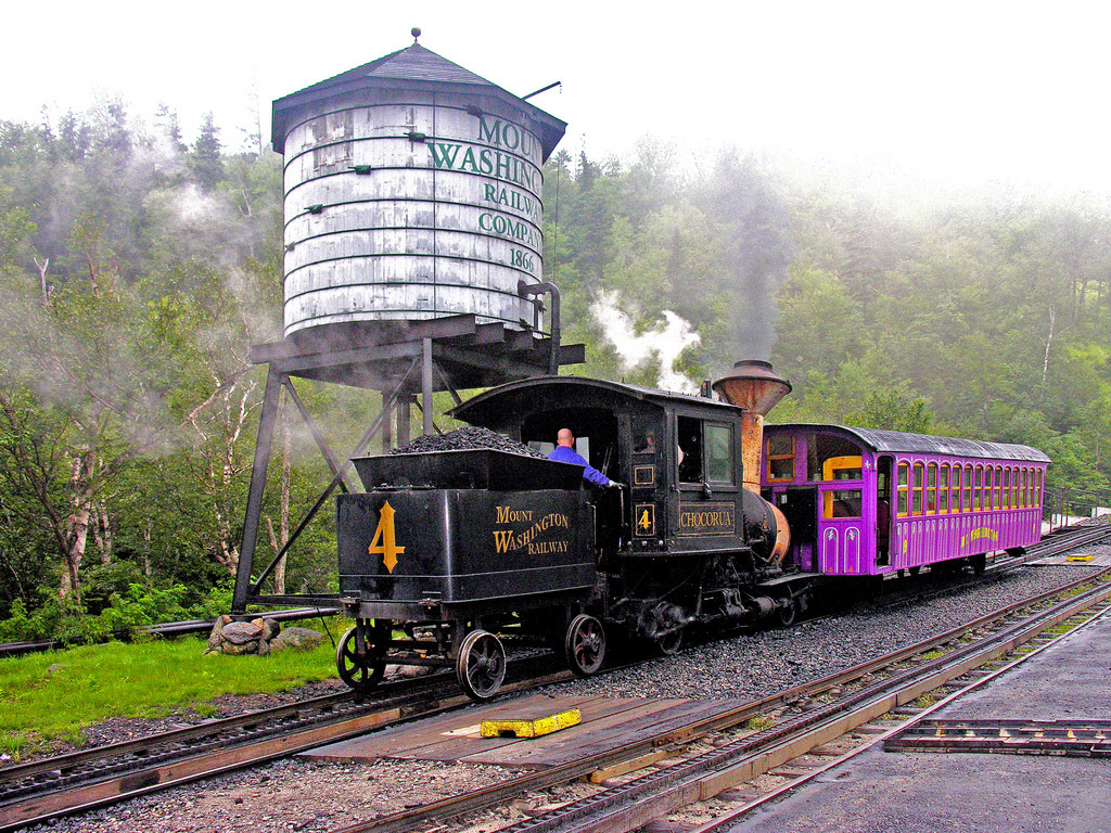 Train next to water tower