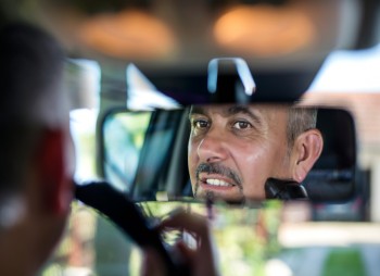 Man shaving while driving