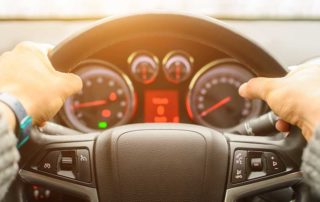 Person in car ready to drive after spending their tax refund on a their car.