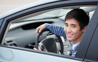 Cheap car insurance for new drivers - young man in new car