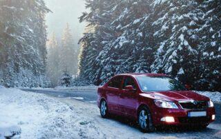 Red car driving in snow - do I need snow tires?