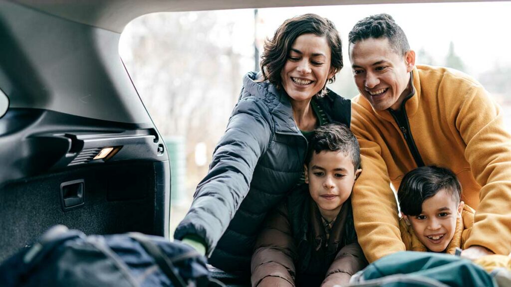 Family packing car - how to road trip on a budget