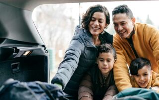 Family packing car - how to road trip on a budget