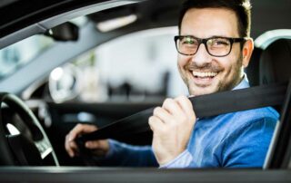 Safety tips for new drivers - man buckling seat belt