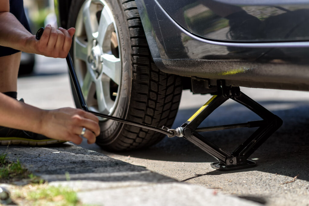 changing tires on a car / car jack / car lift for a flat tire