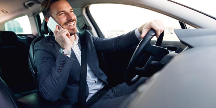 Man driving and talking on a mobile phone