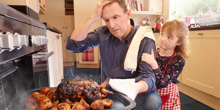 Dad with burnt food and young daughter