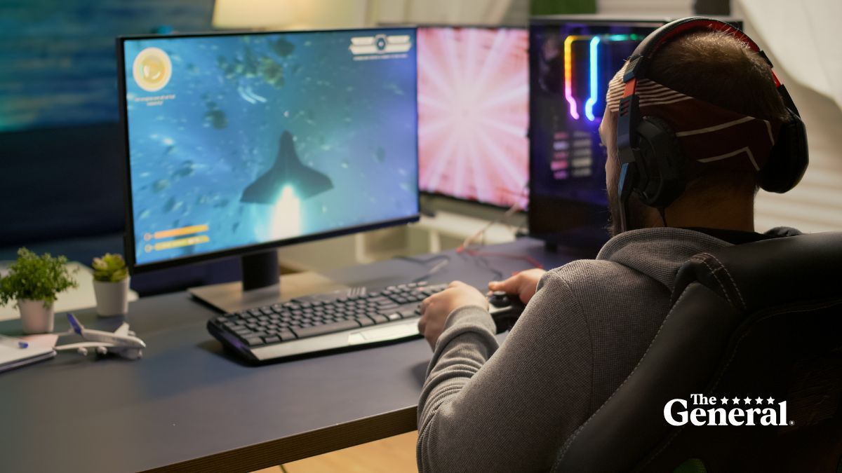 Depicted: Young renter playing video games. Renters insurance can help cover valuable items in your rental, apartment, townhouse, etc.